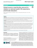 Global trends in total fertility rate and its relation to national wealth, life expectancy and female education