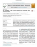 Spin correlations in (Mn,Fe)2(P,Si) magnetocaloric compounds above Curie temperature